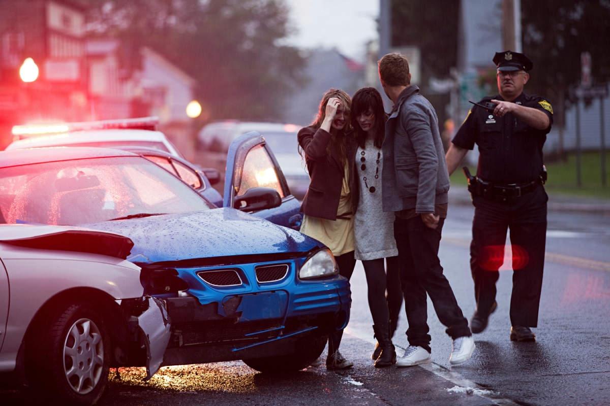 Car accident scene illustrating driver negligence in a personal injury settlement case